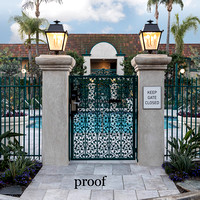 _M2_2955-remove stains on both gate columns ,remove hotel behind red tile roof, keep all palm trees, replace white sky with clouds provided, remove blue cone left of gate